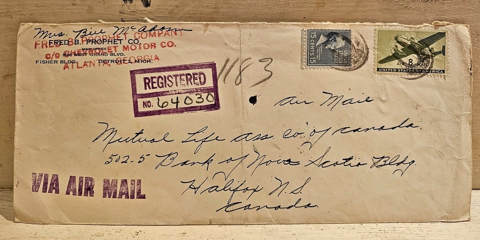 Vintage airmail envelope: Detroit to Halifax with stamps and cen