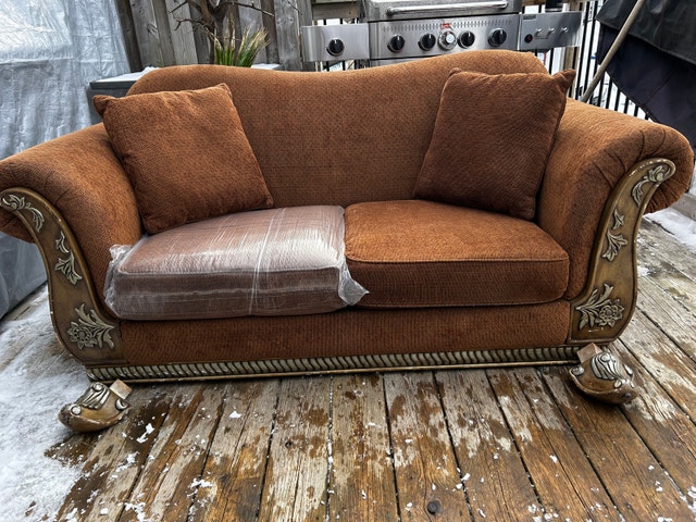 Brown Loveseat Sofa with Carved Wood Arms