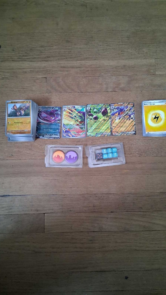 694 Assorted Pokemon Bulk Cards with Coins and Dice