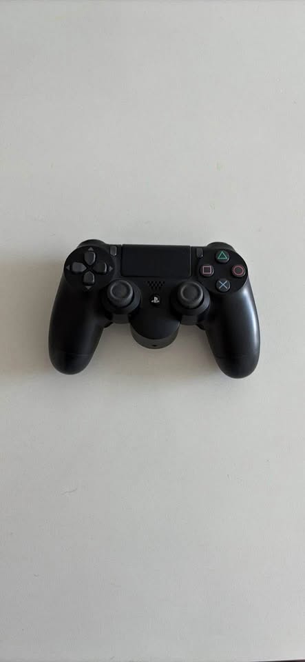 PS4 controller (with optional back buttons)