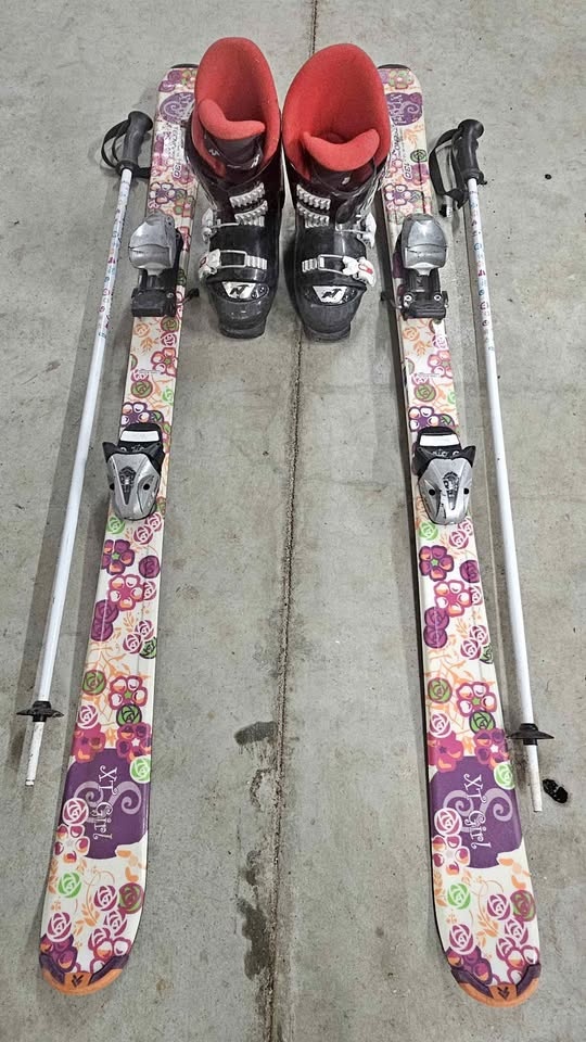 Girls skis, poles, bindings and boots.