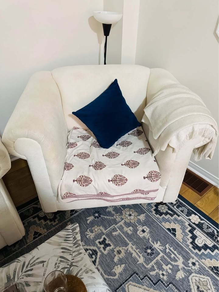 Cream-coloured Armchair.