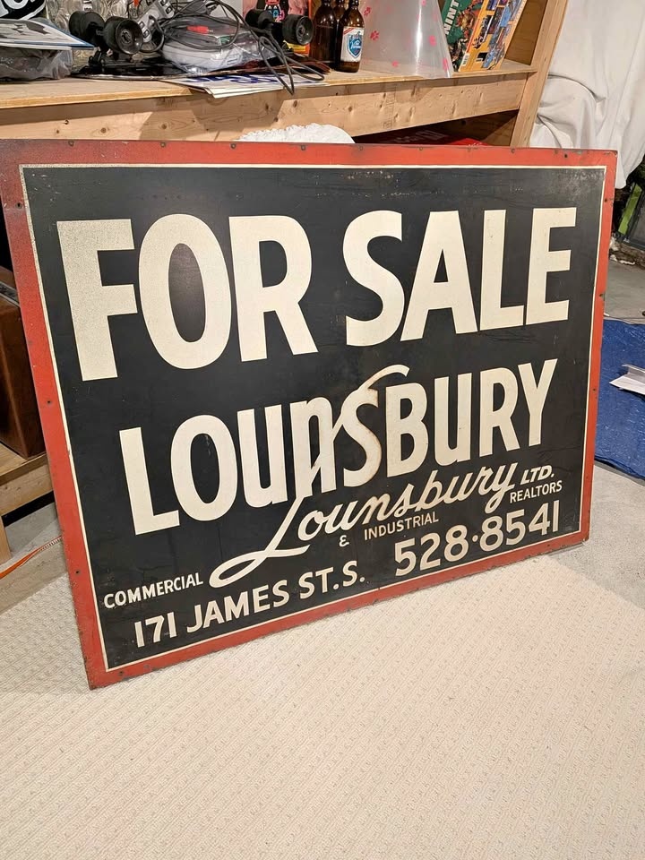 Vintage Lounsbury LTD Real Estate Metal Sign