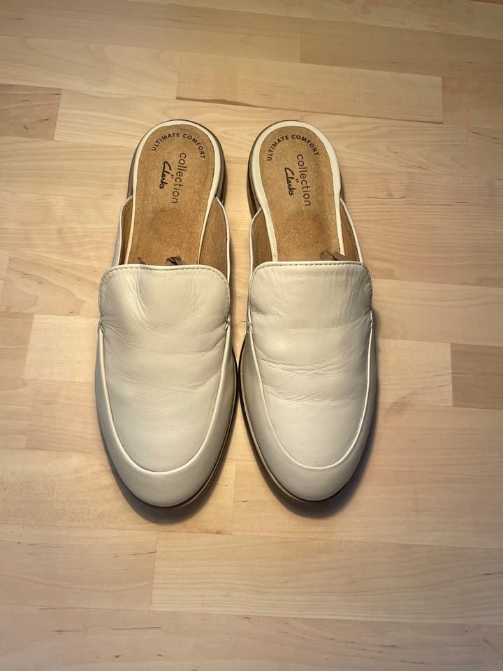 US 6.5, Clarks Trish Plant mules in ivory leather.