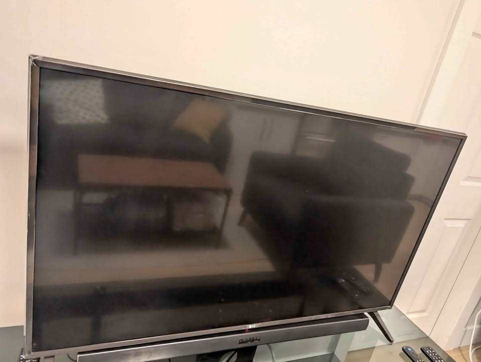 LG 49" 4K UHD Smart TV with Soundbar and Subwoofer