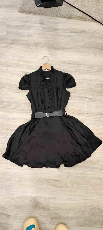 Black dress with puffy sleeves, high neck, belted