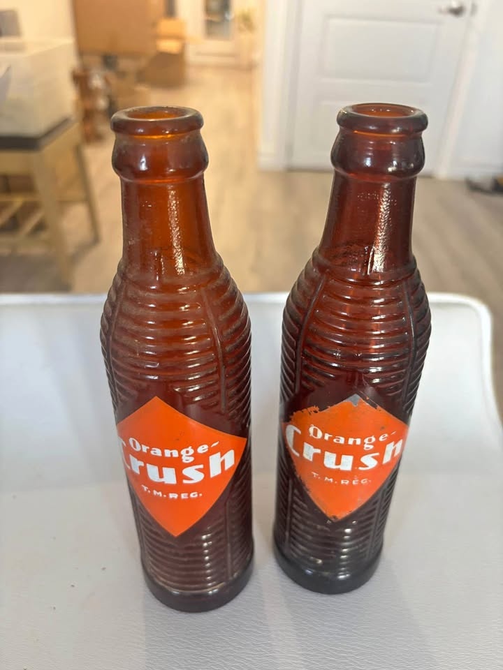 Two vintage Orange Crush bottles - Canadian made 8 1/4"