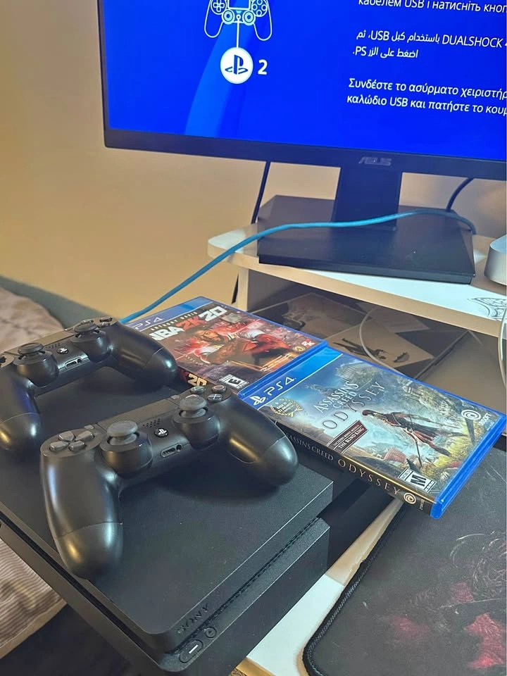 PS4 1TB Slim Model, 2 Controllers, 2 Games