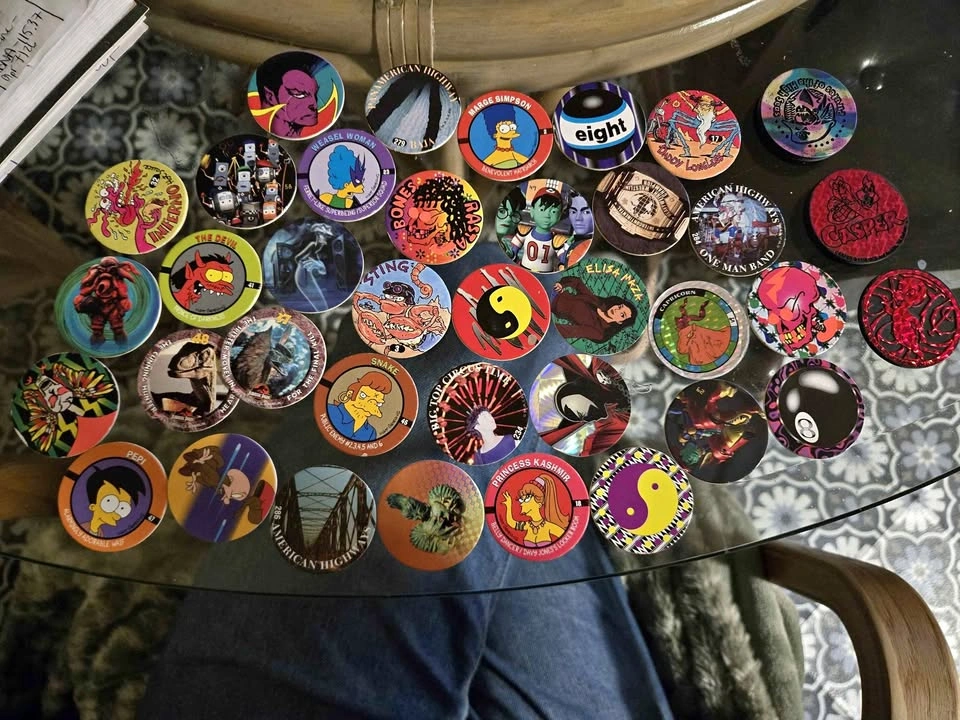 Big collection of pogs - Simpsons, Casper, Spawn & more