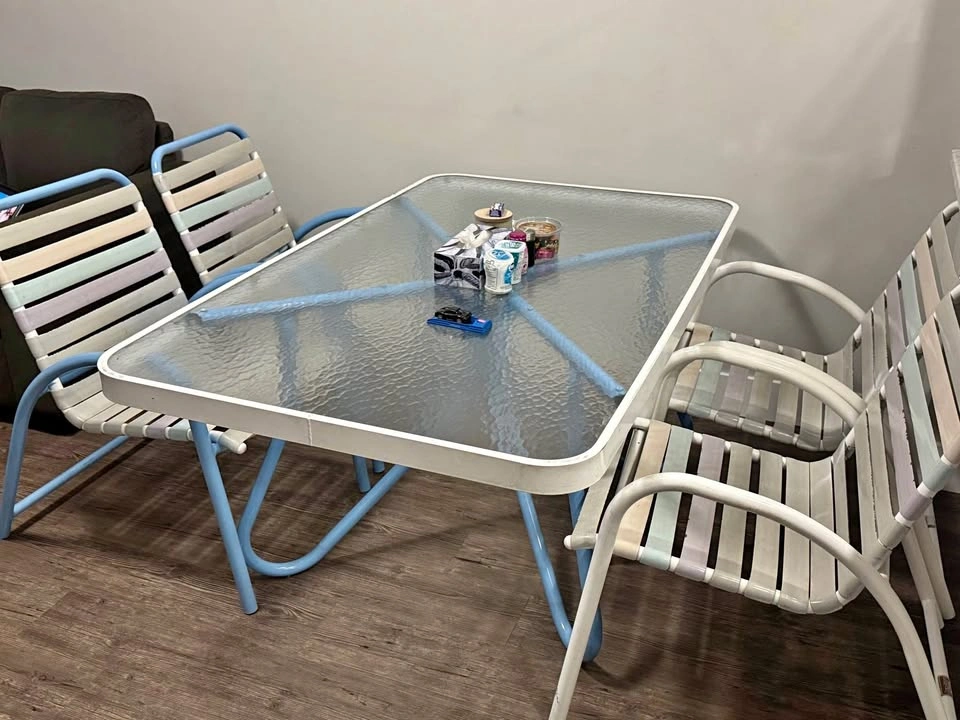 Glass top table with four chairs