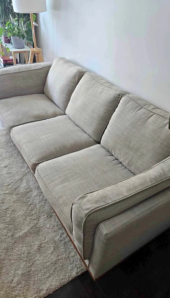 Light grey 3-seater sofa wood base
