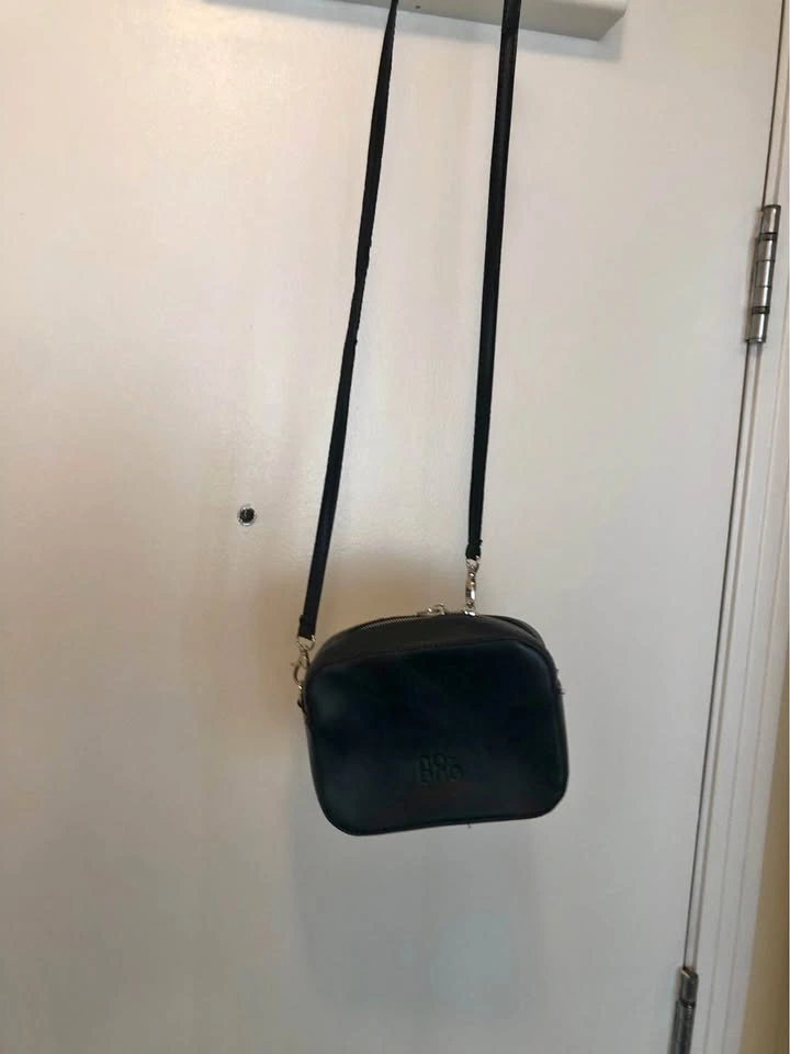 Super Cute Novin Charm Black Leather Cross Body Bag.