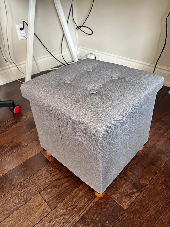 Grey tufted storage ottoman