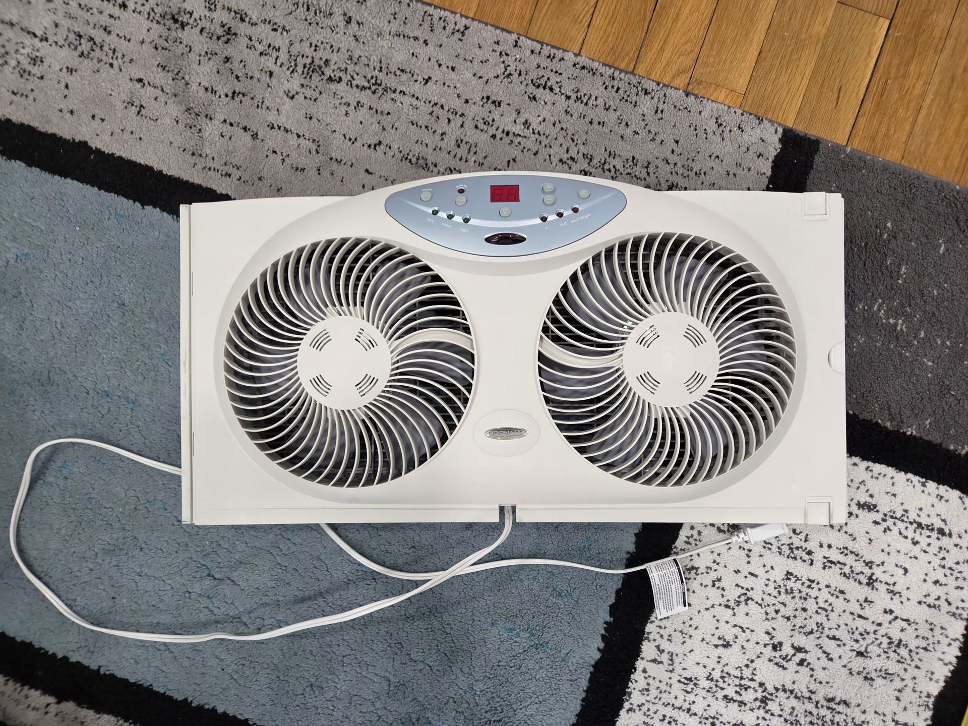 Window Fan with Reversible Airflow Blades