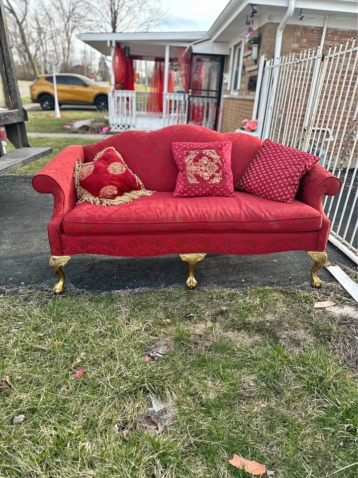 Vintage Chippendale-style camelback settee