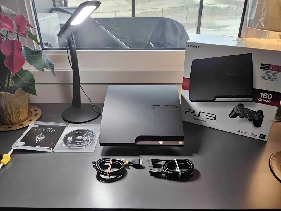 PS3 (W/ box and cords) + game