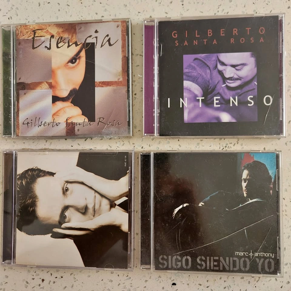 Gilberto Santa Rosa and Marc Anthony CDs