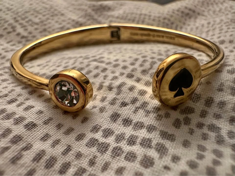 Gold colour Kate Spade bangle bracelet