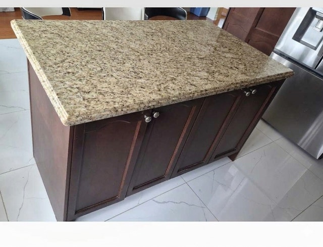 Kitchen Island with Granite Top and Dark Wood Cabinetry