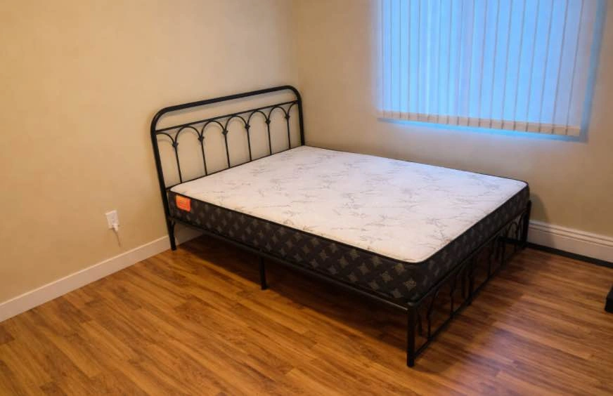 Full size black metal bed frame and mattress