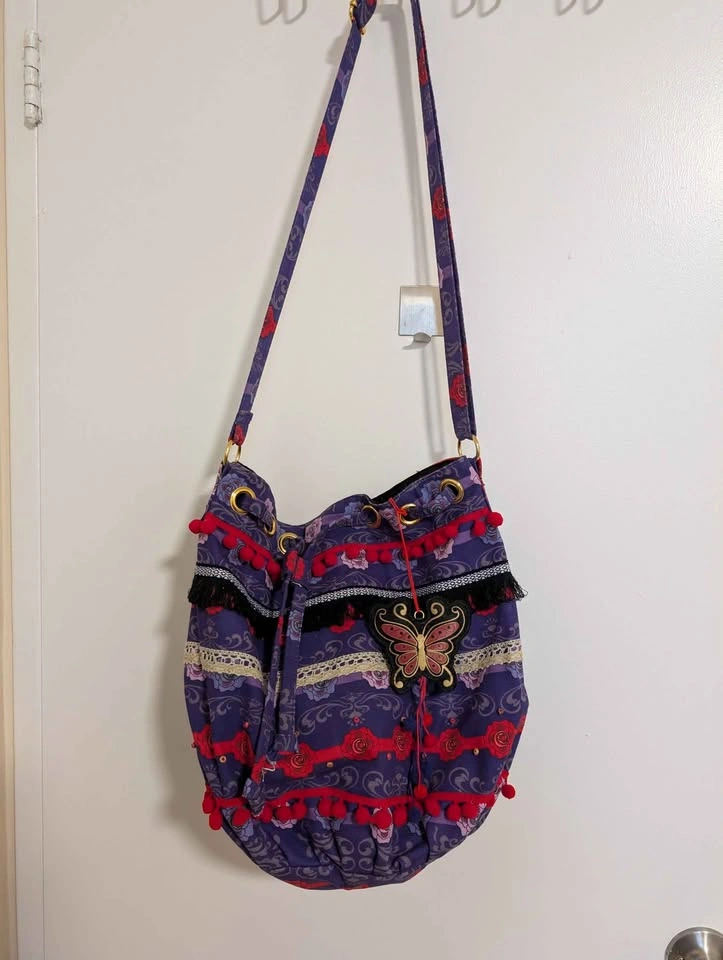 Anna Sui Drawstring Bucket Bag with Butterfly Charm - photo 4