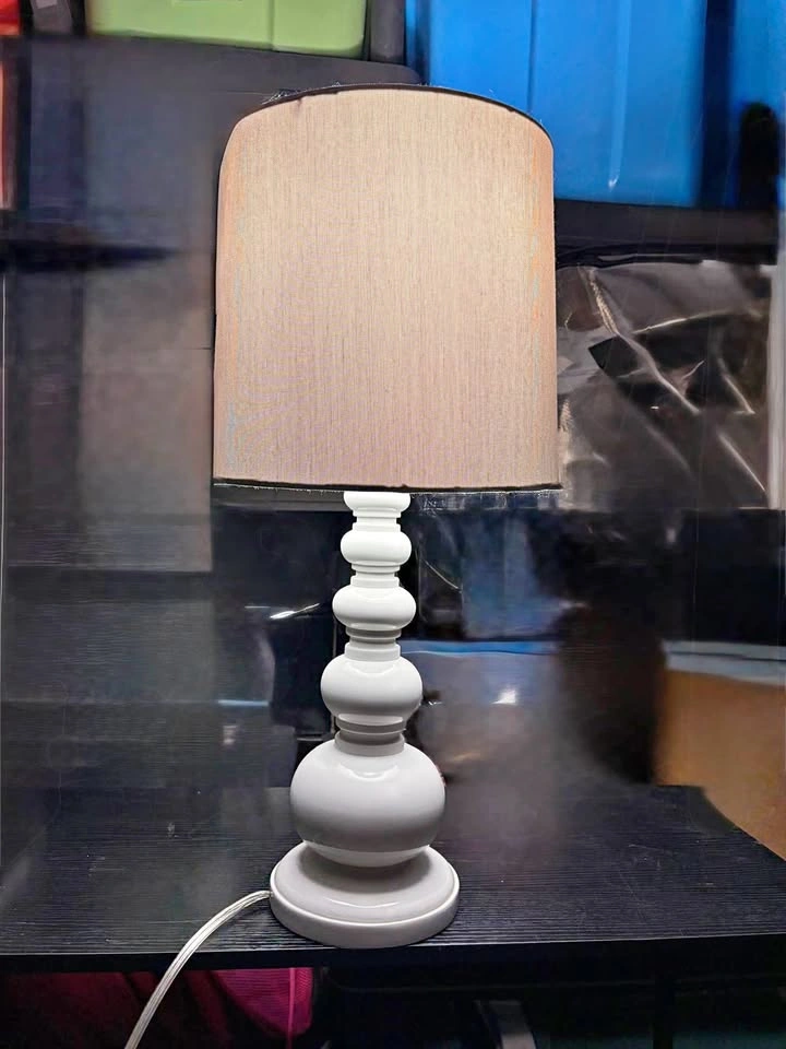 Heavy white lamp with greyish shade