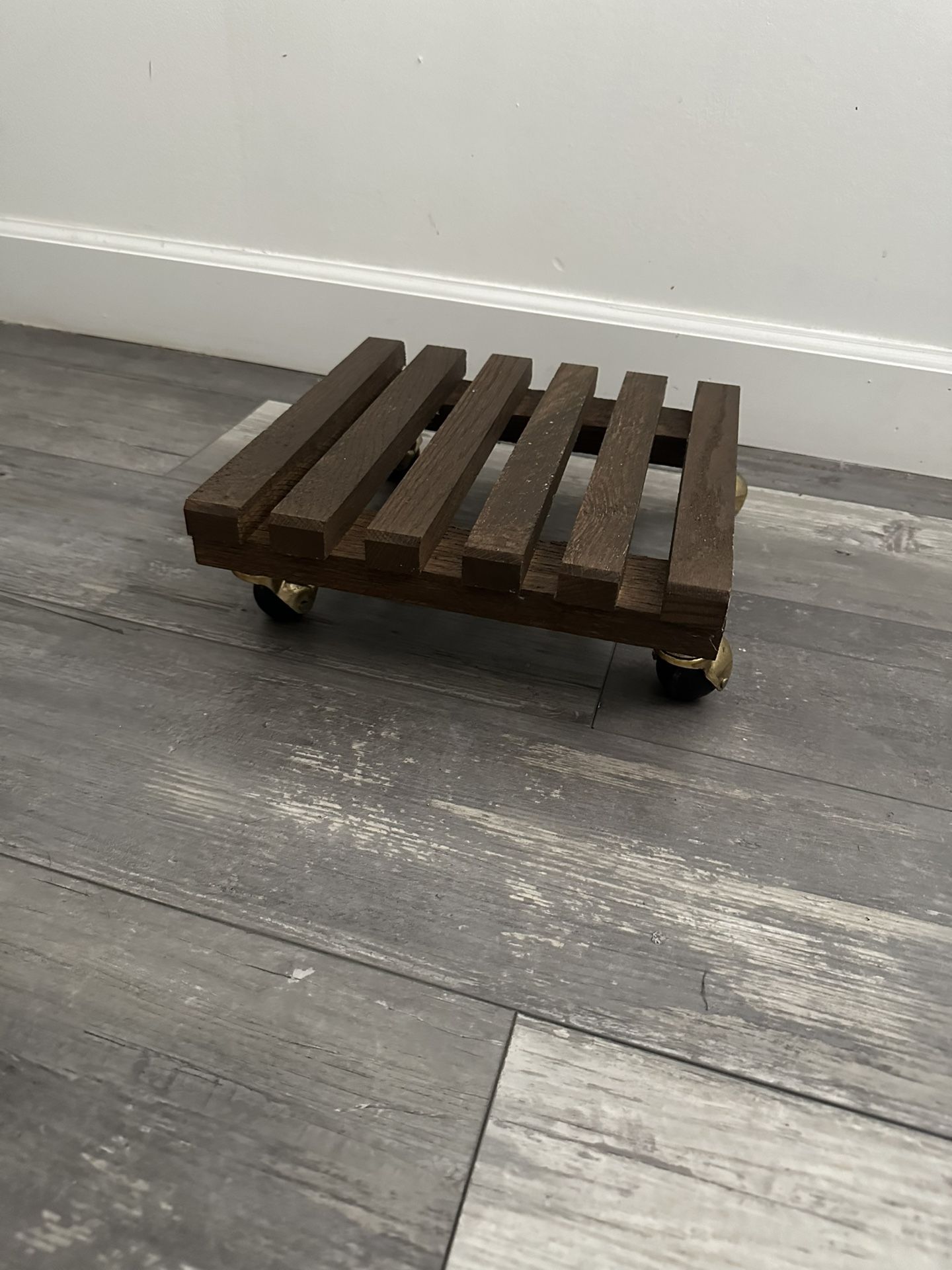 Wooden base with wheels