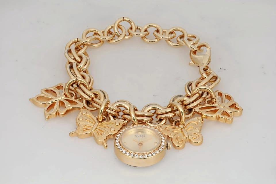 Guess Charm 20mm Gold-Tone Crystal Champagne Dial Ladies Quartz