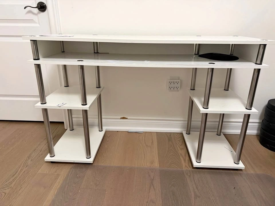 White computer table with 4 small shelf and 1 bug shelf below to