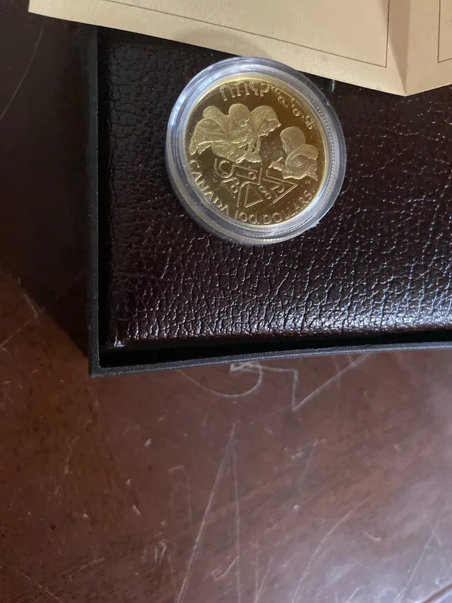 1990 gold coin 100$ thumbnail