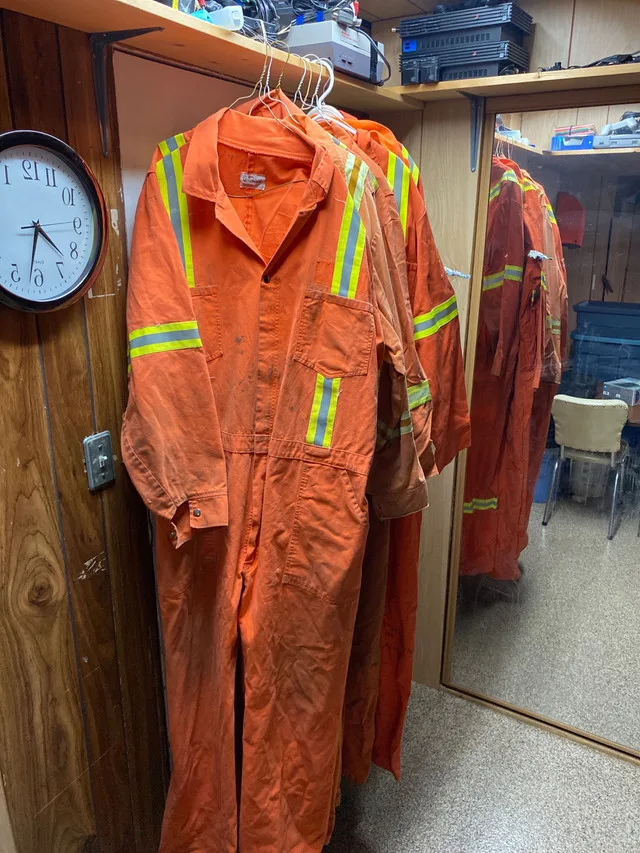 Orange coveralls with high visibility stripes. thumbnail