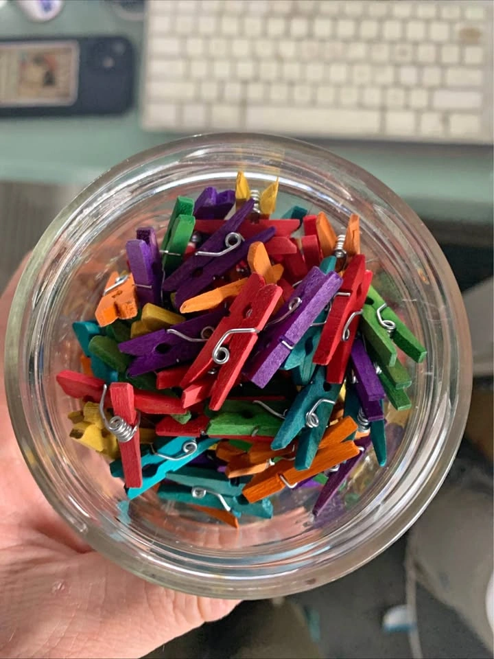Jar of tiny clothespins