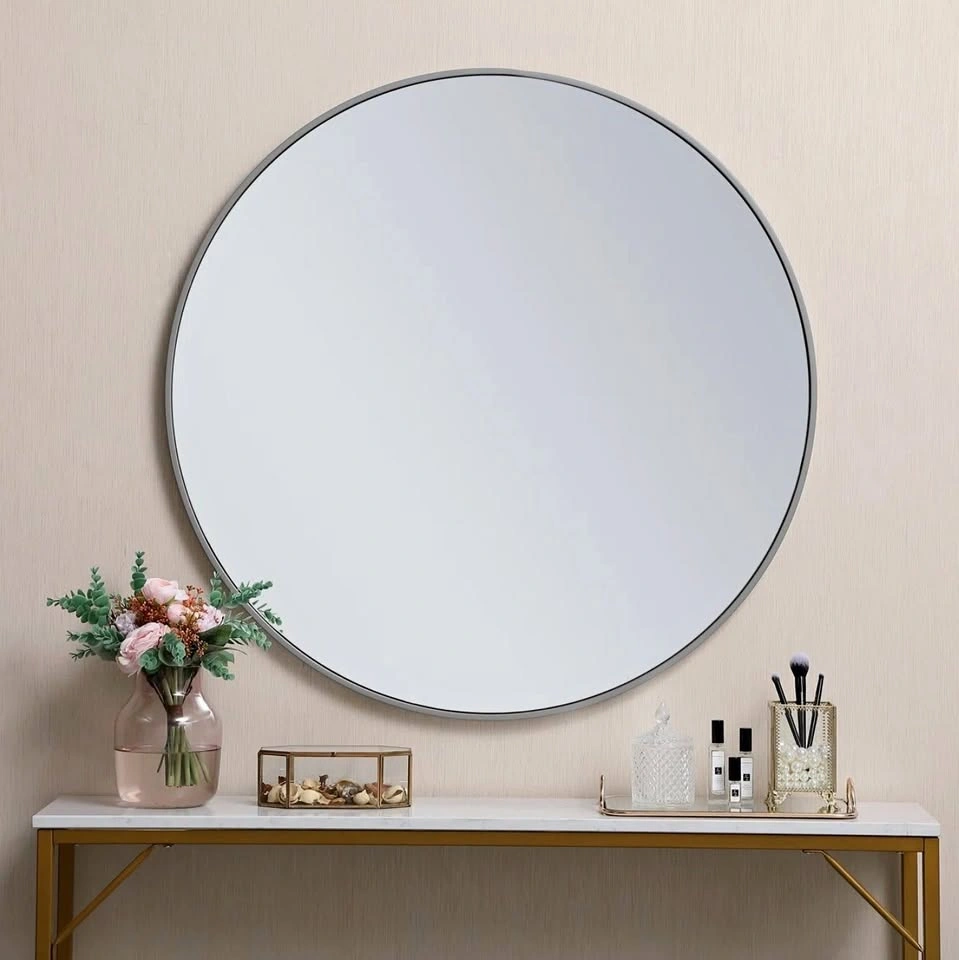 Round wall mirror in matte gray