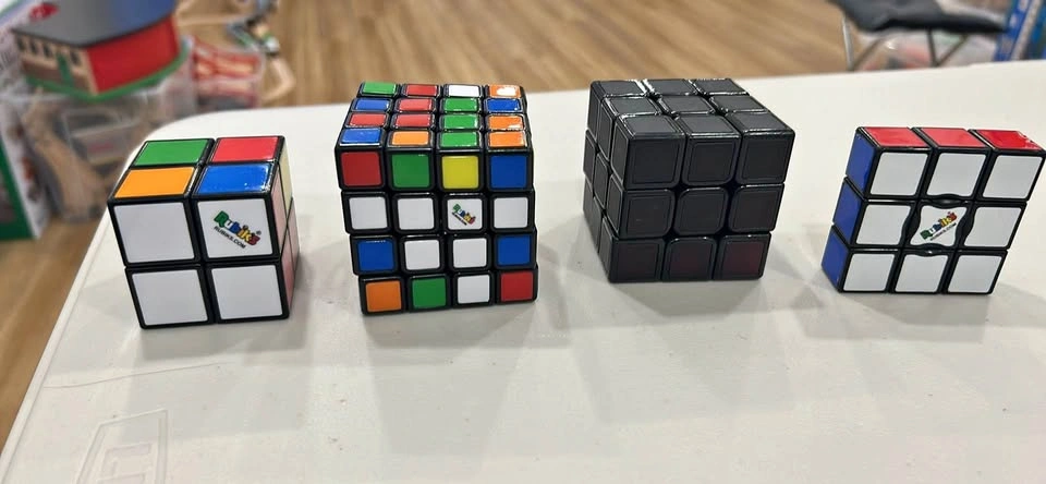 4 Assorted Rubik's Cubes - Like New