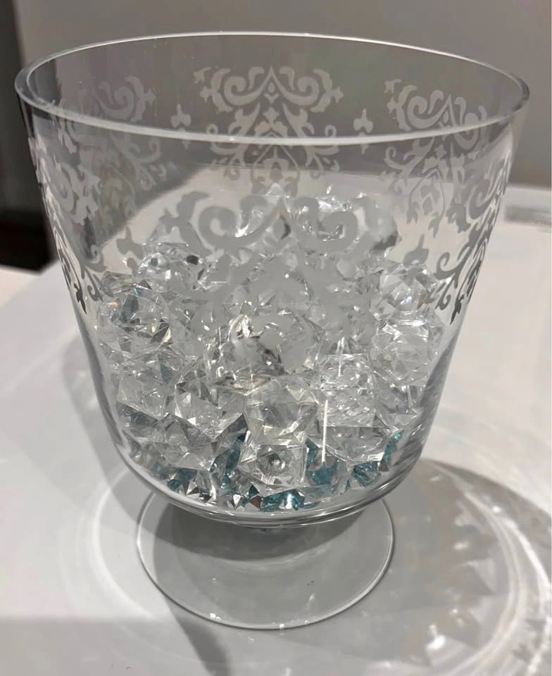 Short glass vase/candle holder with white etching. 6” tall, 5” a