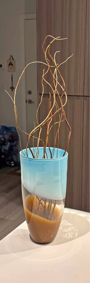 Beautiful tall brown, clear and turquoise glass vase. 12” high,