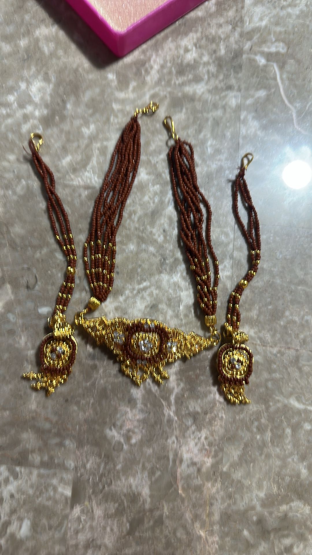 Indian jewelry. Brown and gold work. Necklace and earrings set.