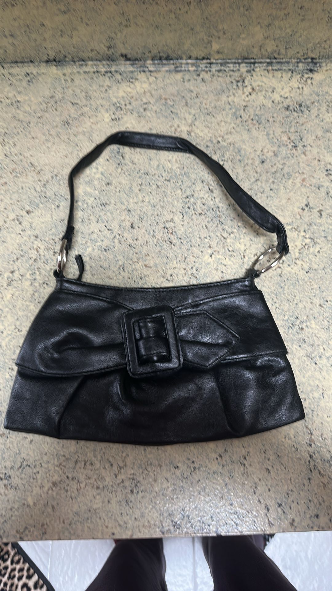 Black lightly used shoulder strap purse with bow tie design