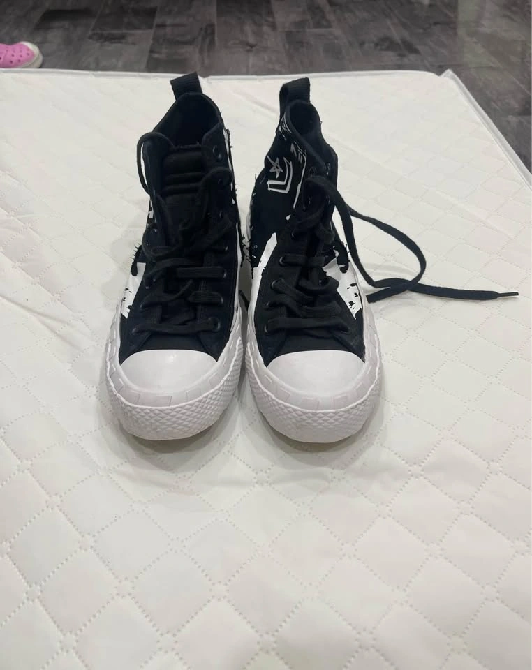 Black and white high top converse