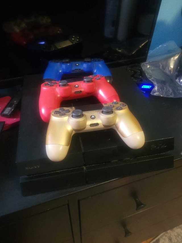 PlayStation 4 with Games and 3 Controllers