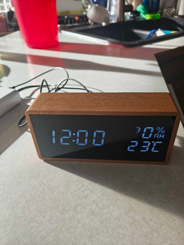 Small digital clock for sale.