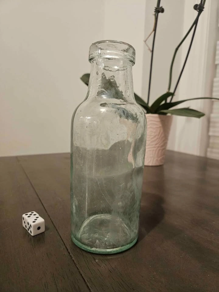 Antique aqua milk bottle