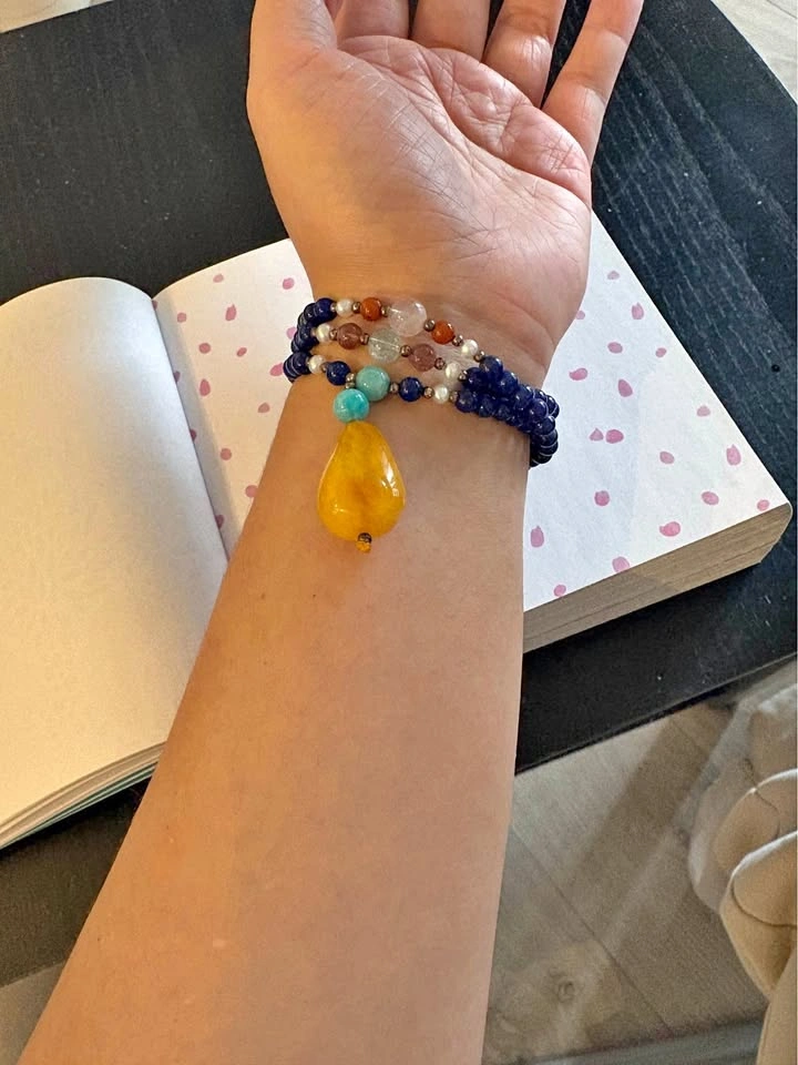 Lazurite beads accessory with opaque amber pendant