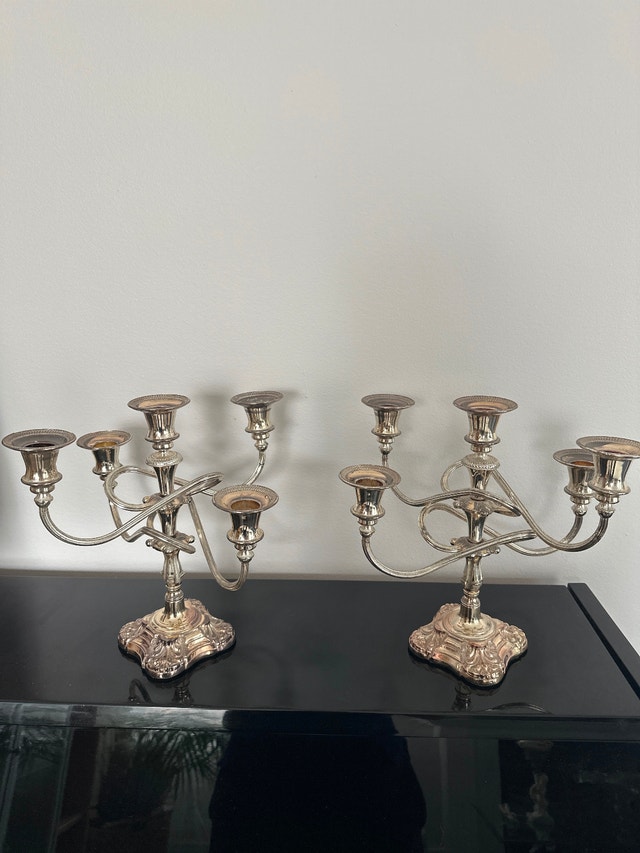 Silver plated 5-arm candelabras, made in England.