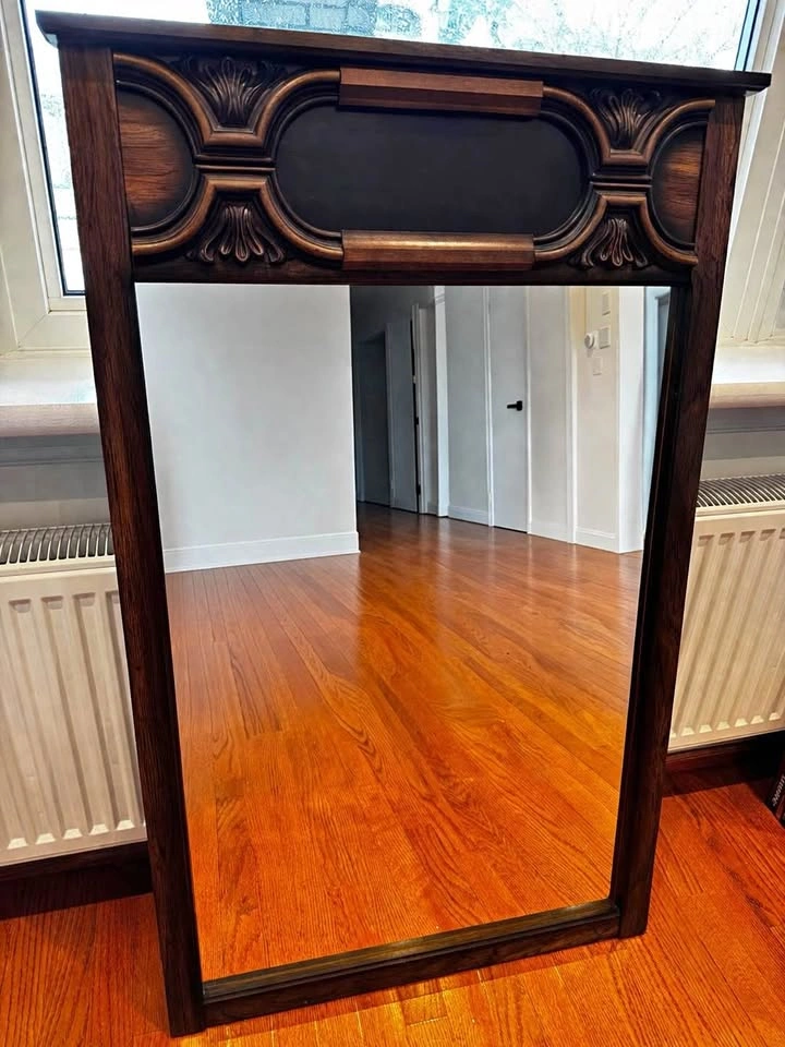Wooden mirror with carved frame