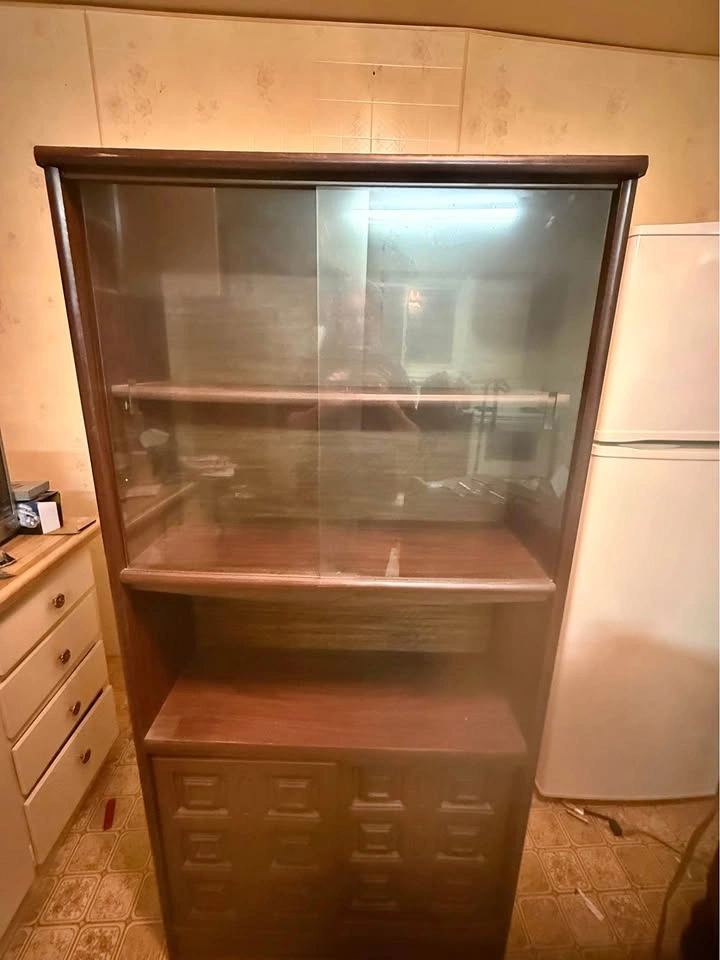 Dark wood display cabinet with glass doors