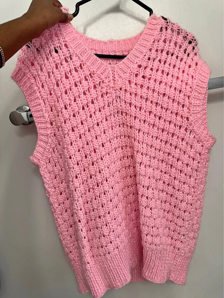 Pink knitted V-neck vest