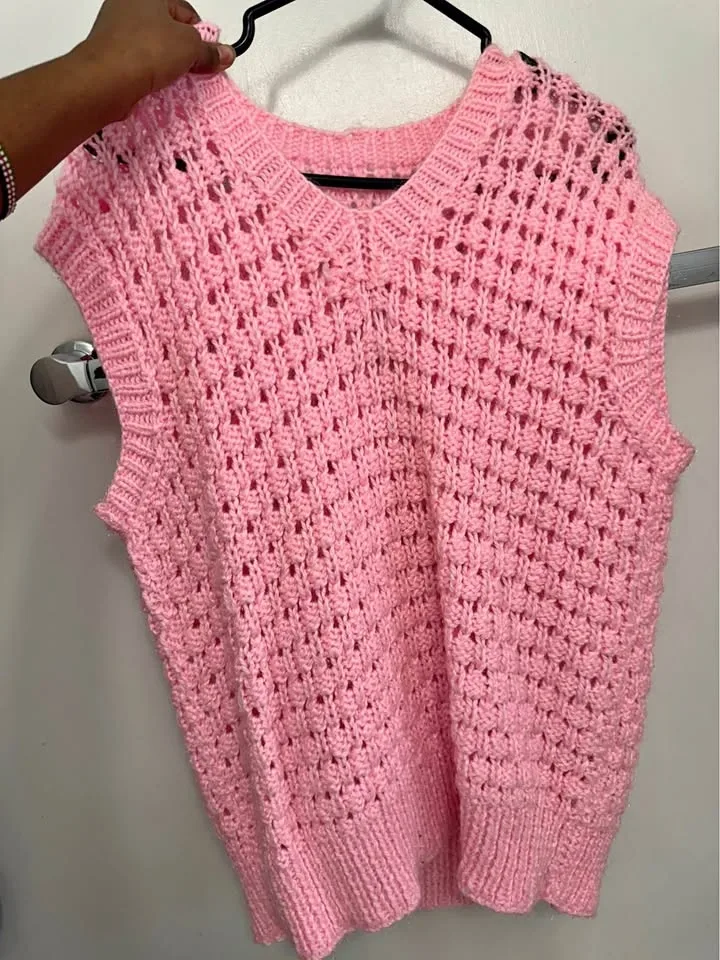 Pink knitted V-neck vest
