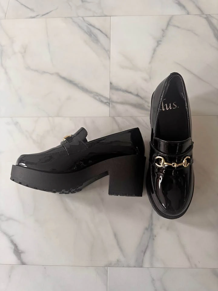 Black heel loafers with gold accent