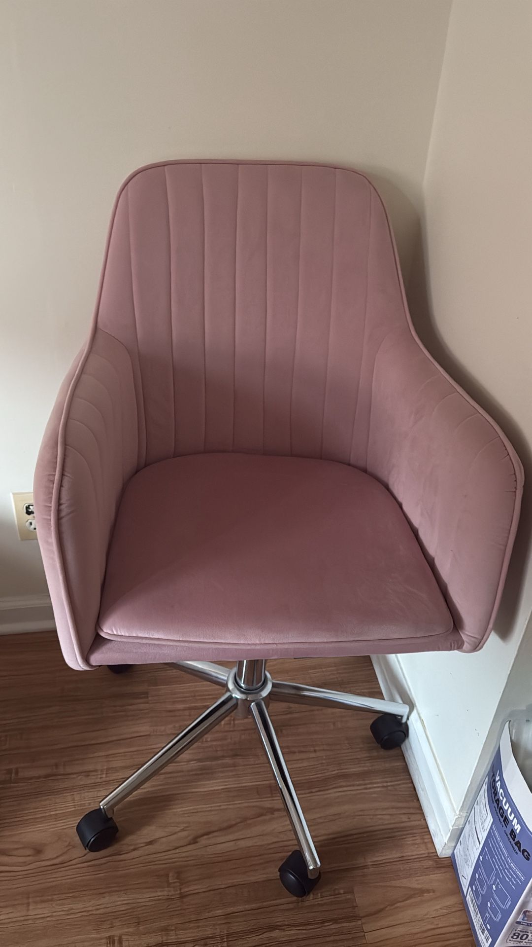 Pink velvet chair on wheels
